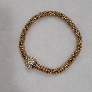 Gold beaded bracelet on elastic with rhinestone charm